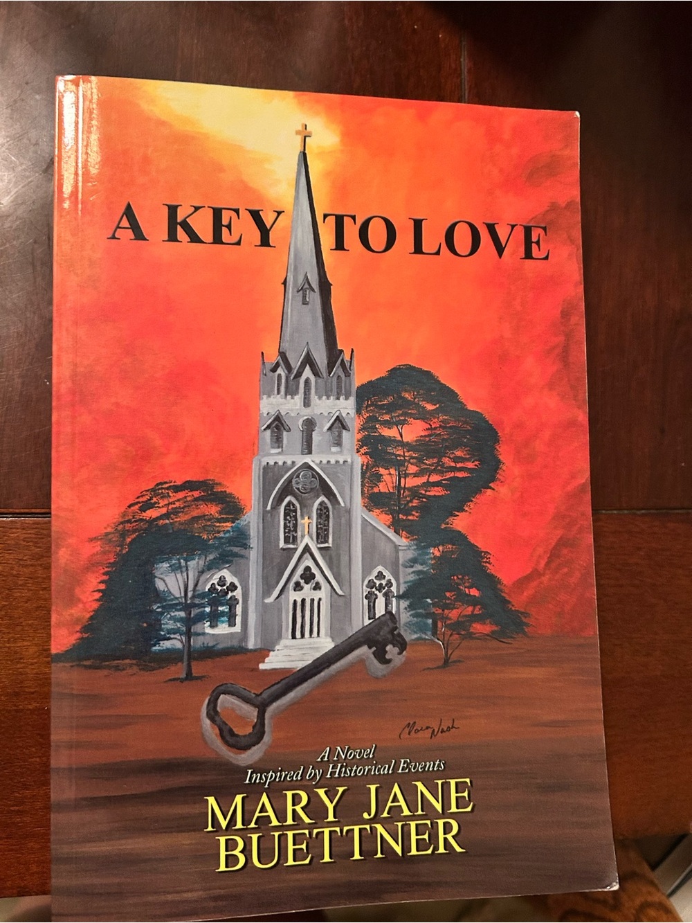 A Key to Love by Mary Jane Buettner - Orange & Gray Book Cover